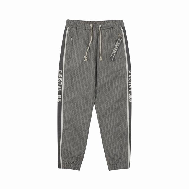Dior all-over jacquard woven trousers with side webbing. Sizes: Xs-L.