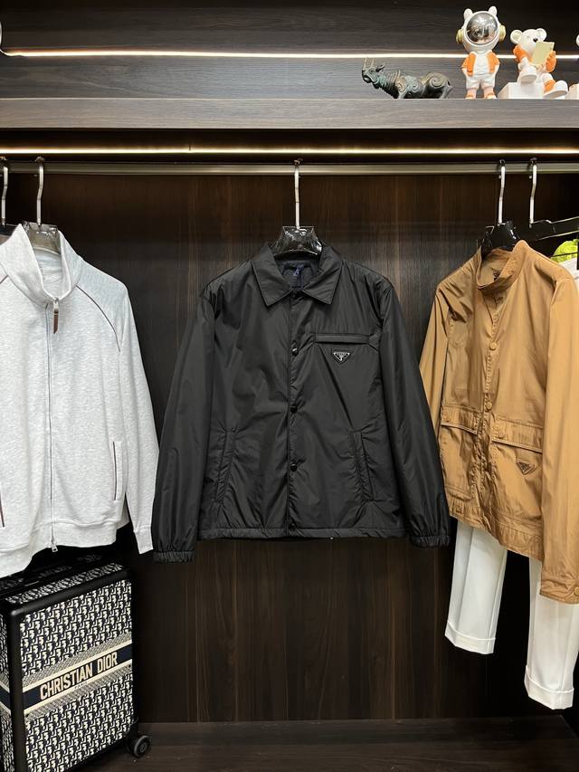 Featured: Prada 2025 latest designer coat with a lapel collar. Every detail sho