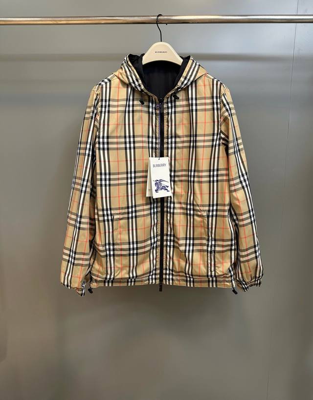 Lightweight Burberry jacket, adorned with fine-woven Burberry check. Features a