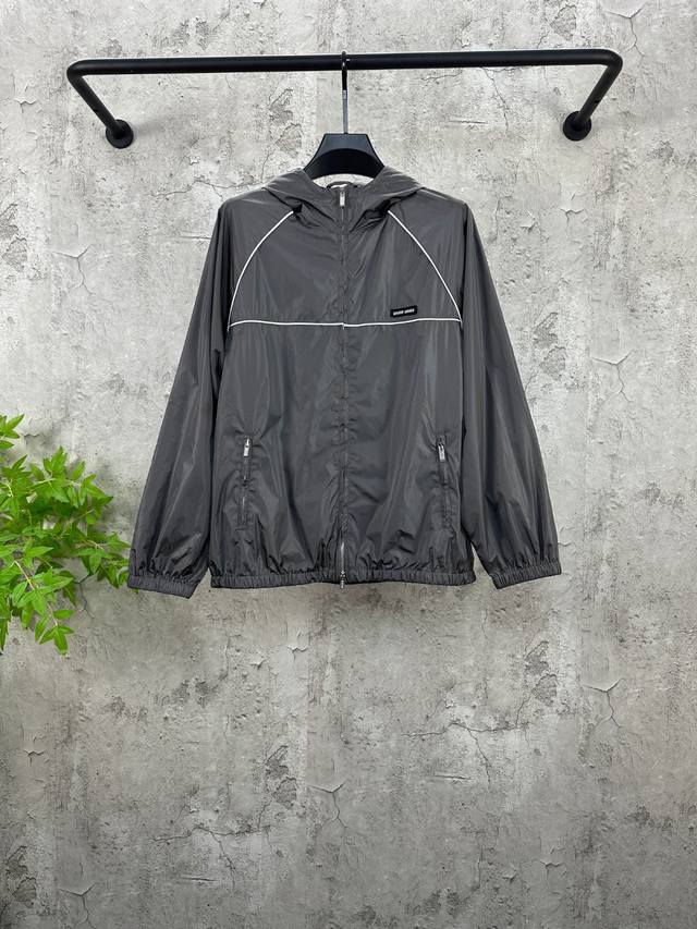 Miu Miu Zip-Up Hooded Jacket. Made with custom-woven cold-pressed microfiber nyl