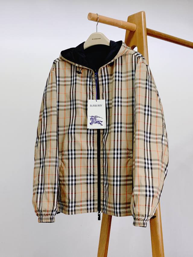 Burberry Reversible Check Hooded Lightweight Jacket embodies dual British style.