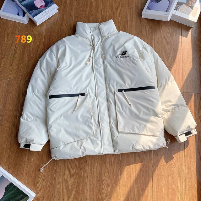 New Balance Japanese-style workwear jacket with large pockets, hollowed-out lett