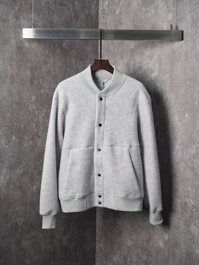 Actual product hanging photo: Canada Goose fleece jacket with patchwork buttons