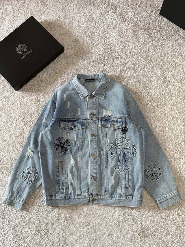 A highly popular distressed washed denim jacket from Crocs, featuring 3D embroi