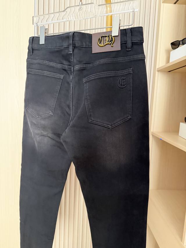 Chrome Hearts - 2025 New Jeans. The metallic leather brand label on the back wa
