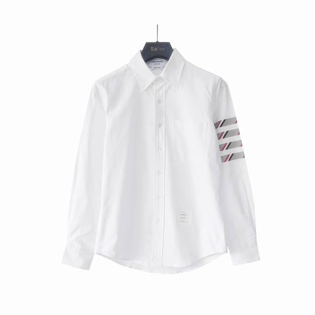 Real shot details Thom Browne. Classic new style red, white and blue striped twi