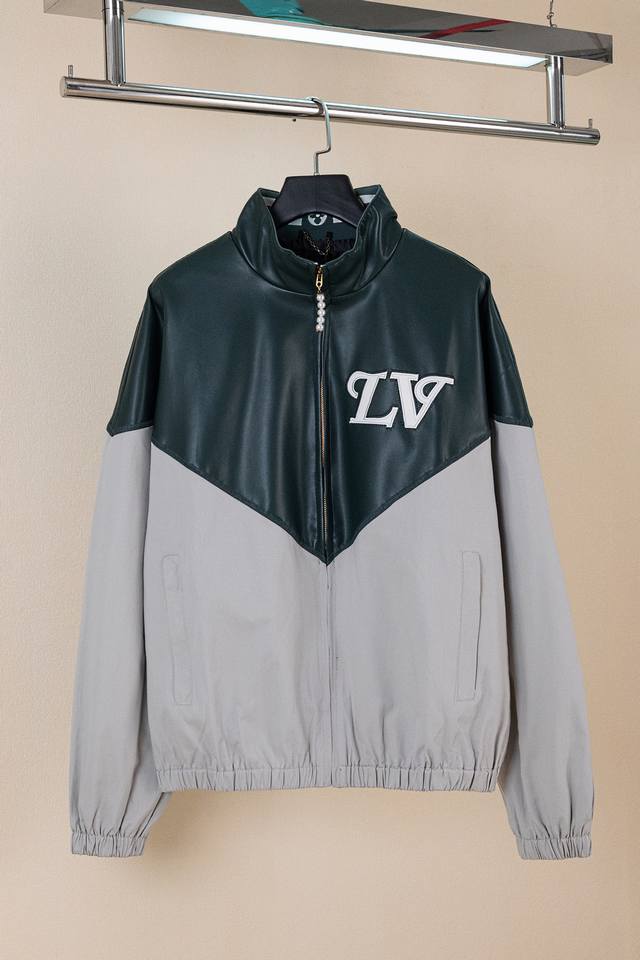 Louis Vuitton color-blocked stand-up collar jacket. The contrast between leather