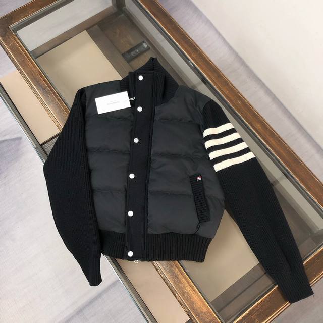 Thom Browne Tb down jacket for women! Filled with white duck down, the filling i