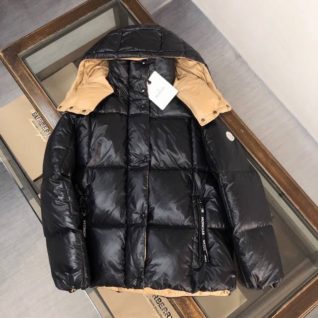 Women's Moncler World# Down Jacket. The clean colors and tailoring create a sop