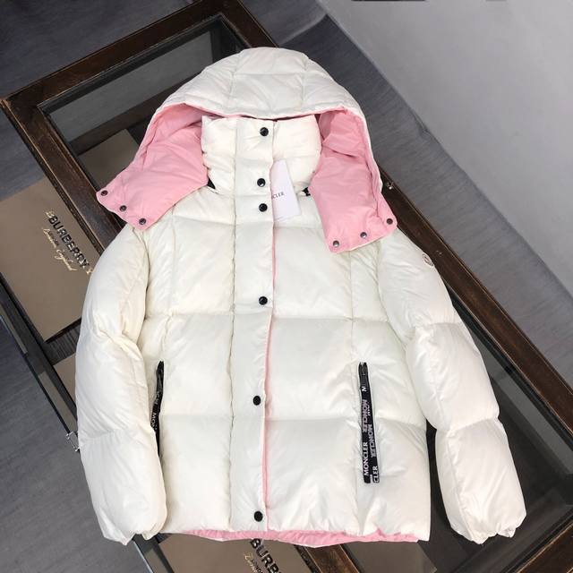 Women's Moncler World# Down Jacket. The clean colors and tailoring create a sop