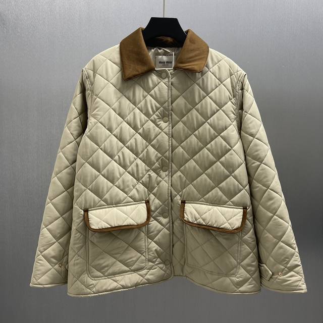 Miumiu Quilted Tech Ponge Jacket Size: S-XL This jacket reinterprets the classic