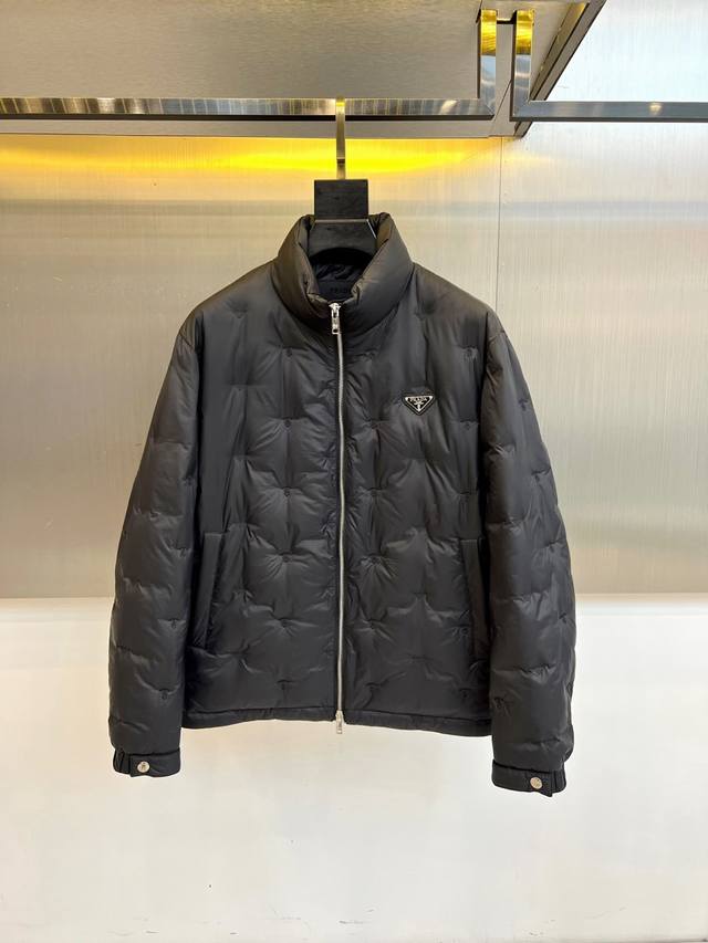 Prada's 2025 Fall/Winter new diamond-quilted down jacket. The black stand-up co