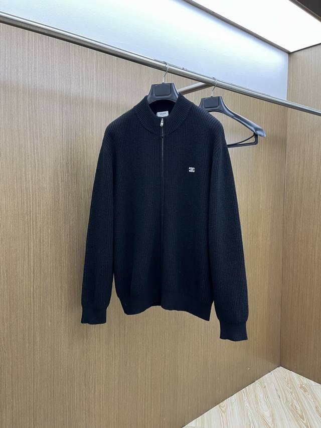Celine Black Knit, a zip-up cardigan concealing French minimalism. The black rib