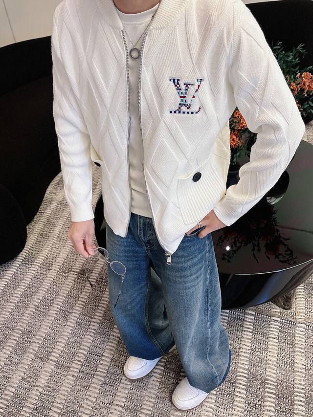 Louis Vuitton Zippered Wool Jacket. Made of a wool blend, this soft knit jacket