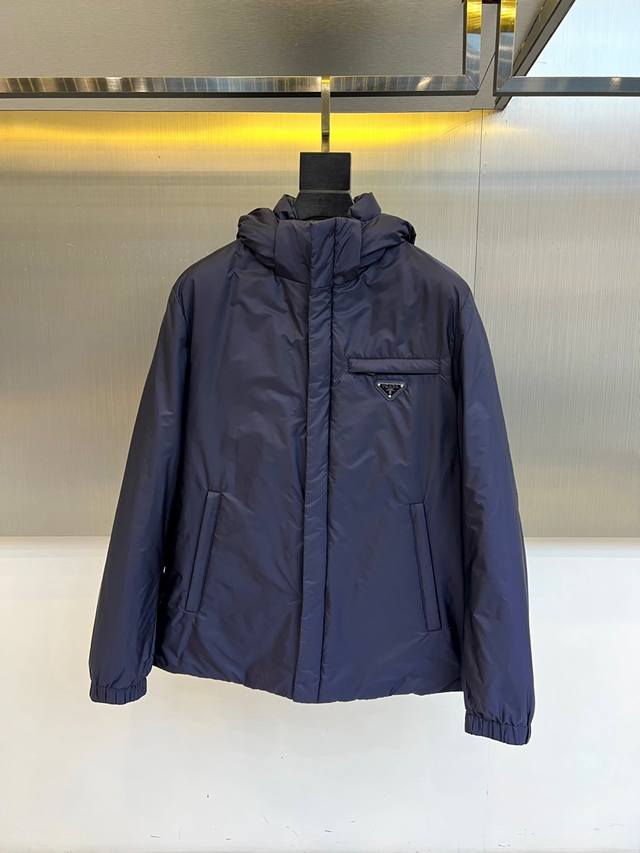 Prad, 2025 Fall/Winter New Down Jacket. This hooded down jacket features a thre