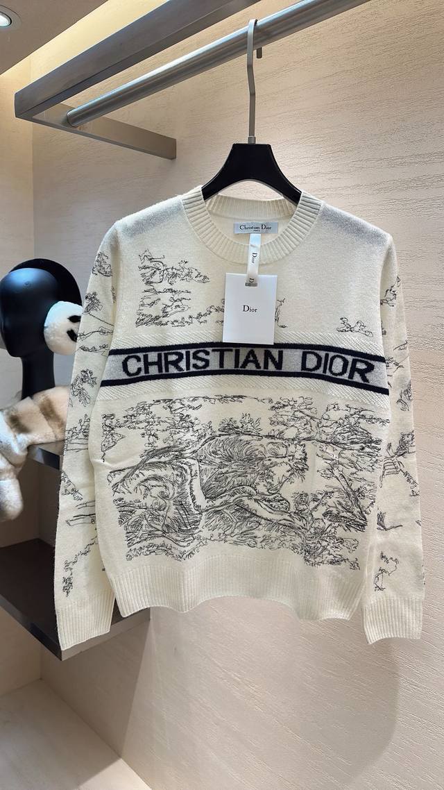 Dior's artistic wool knit sweater. Classic white base with delicate ink-wash emb