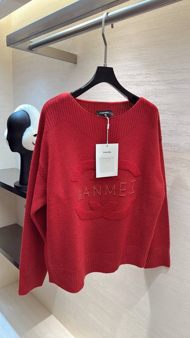 This Chanel soft and cozy sweater has an inherently sweet and feminine charm. T