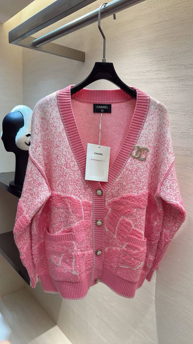 This Chanel pink cardigan is absolutely divine! The pink and white mix is fresh