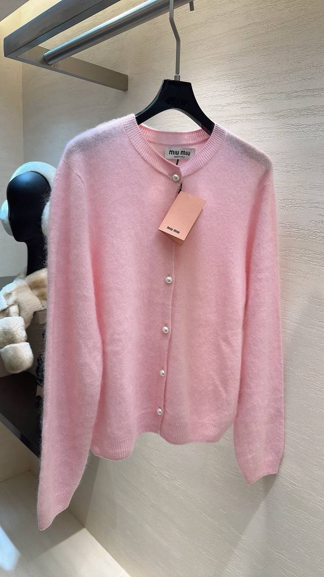 Miu Miu sheep wool and cashmere cardigan, perfectly capturing both gentleness an