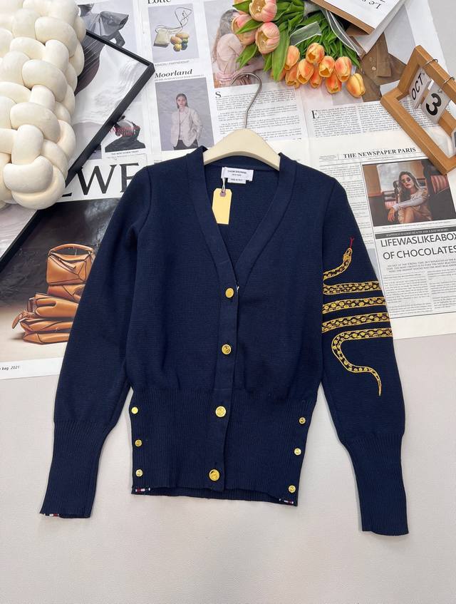 Thom Browne classic gold-buttoned knit cardigan. Made of lightweight, breathable