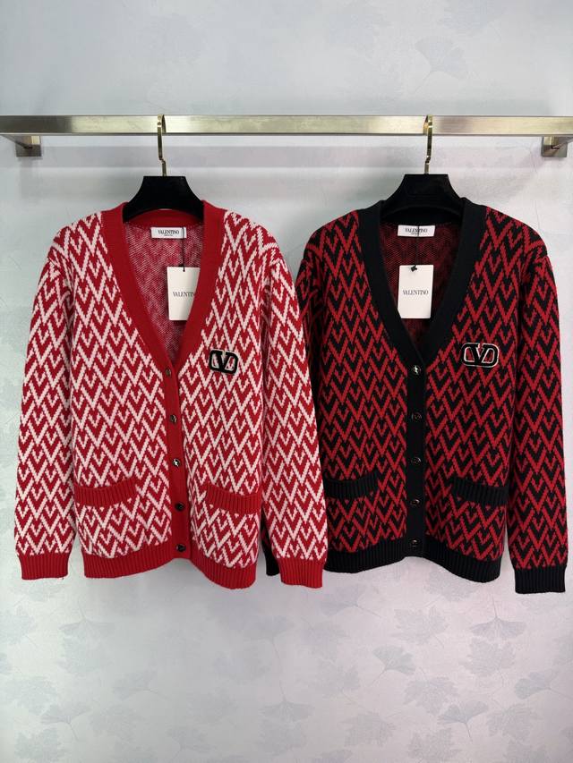 Valentin* This V-neck knit sweater features a striking red base with white geome