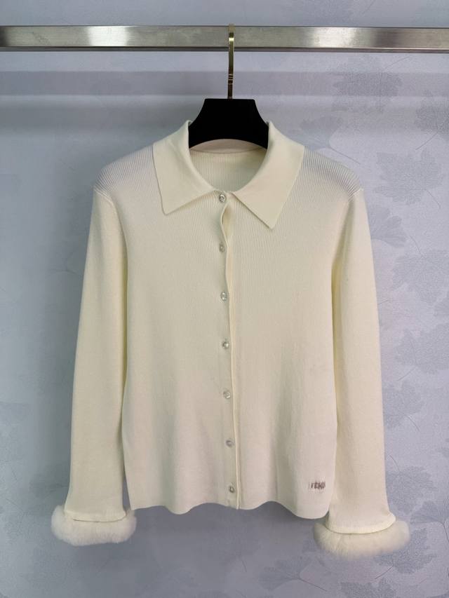 This off-white Fendi knit sweater features a polo collar and single-breasted de