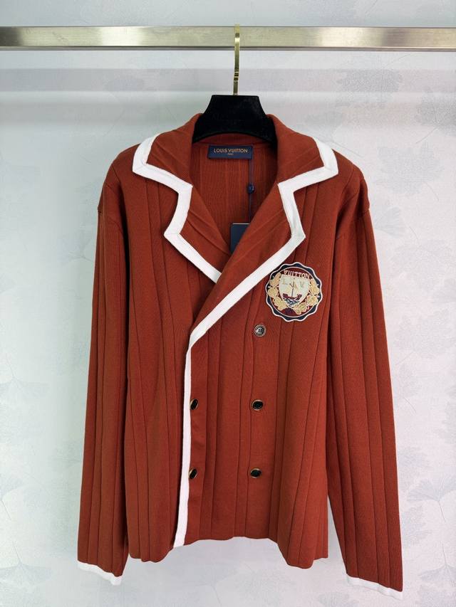 This Lou preppy style knit sweater features red vertical stripes and a white-tr