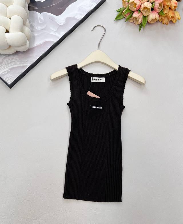 Miumiu stretch knit vest with delicate lace trim at the neckline. Lightweight an