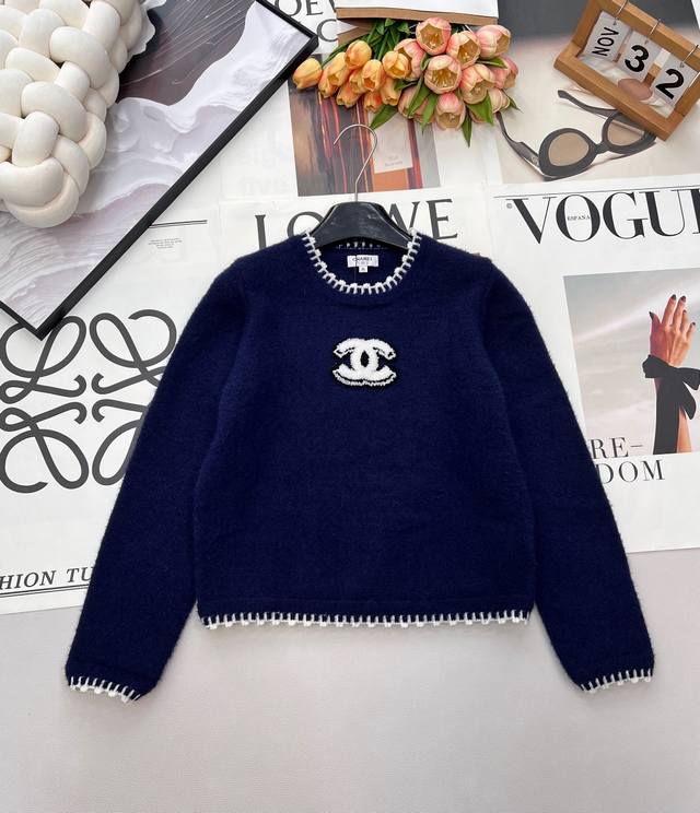 Chanel 2026 New Navy Blue Knit Sweater. The navy blue base perfectly complements