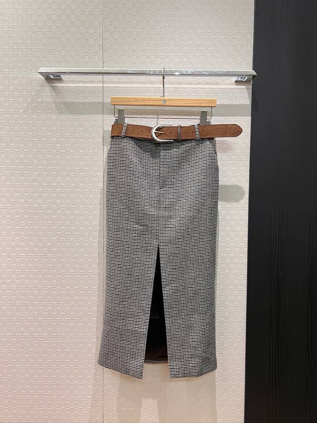 New houndstooth wool slit midi skirt with beaded chain and suede belt. Features