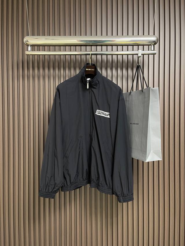 Balenciaga Plastisol Print Jacket. The brand logo on the front of the jacket is
